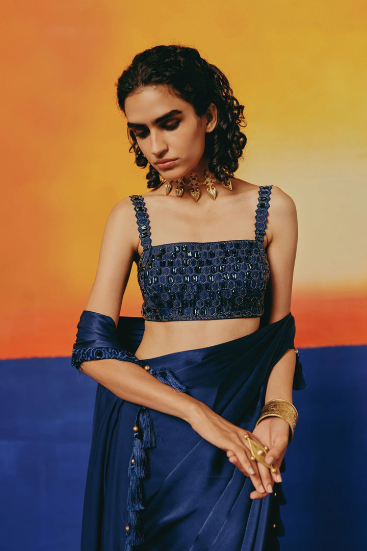 Close-up of the crystal-embellished navy satin blouse and tasseled waist sash on Warra's Crystal Blue Tassel Saree, paired with a gold spike choker
