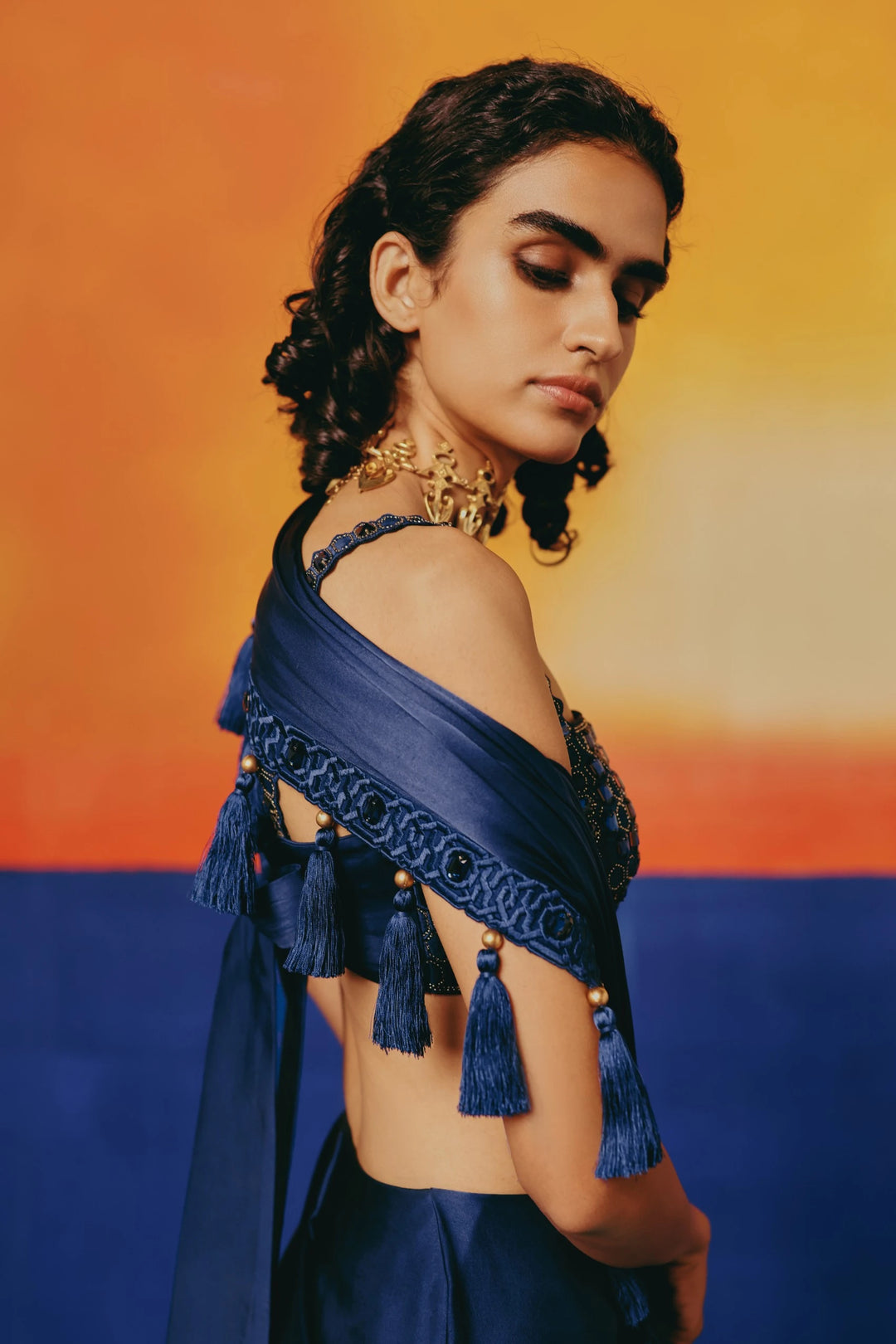 Close-up side view of the tasseled sash and crystal-studded border on Warra's Crystal Blue Tassel Saree draped over the shoulder