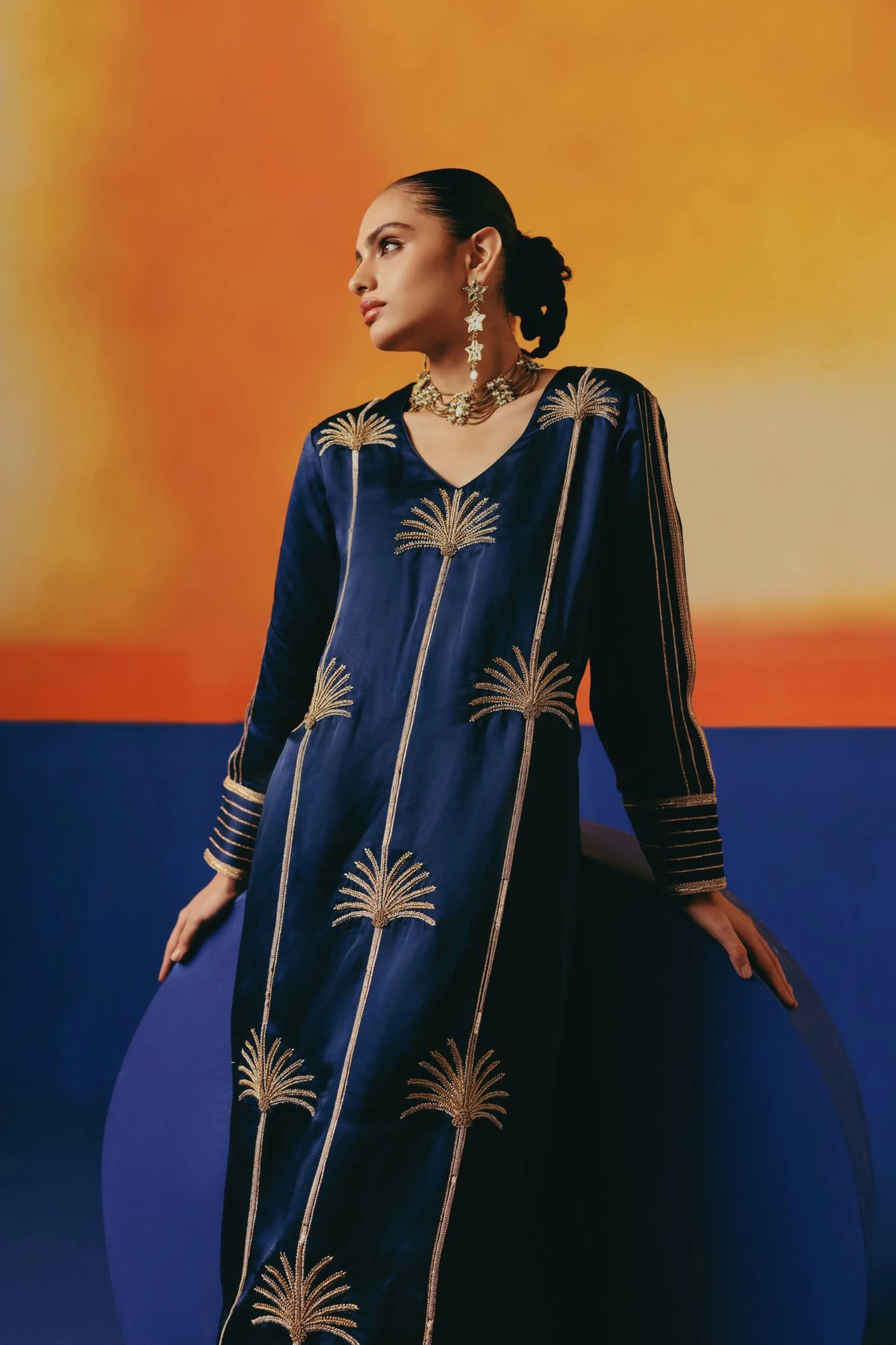 Warra's long-sleeved navy blue kurta set with gold palm tree embroidery